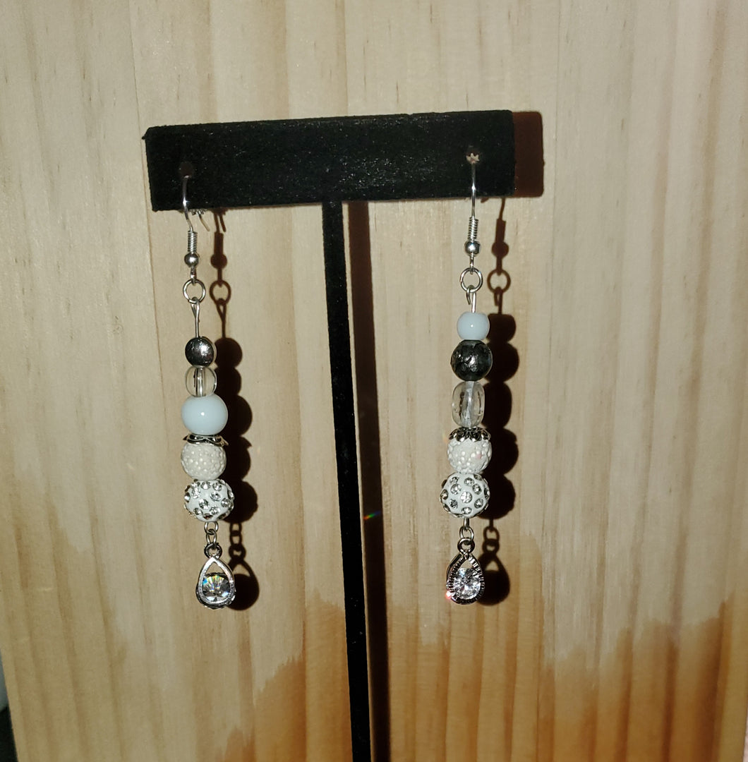 White and silver stud earrings