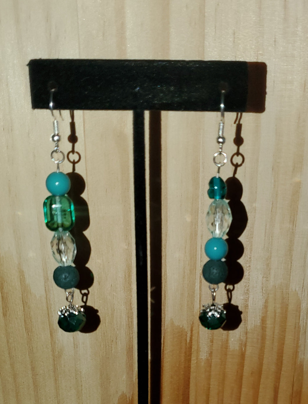 Turquoise earrings with emerald and silver charm